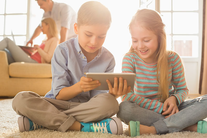 Kids holding a tablet computer